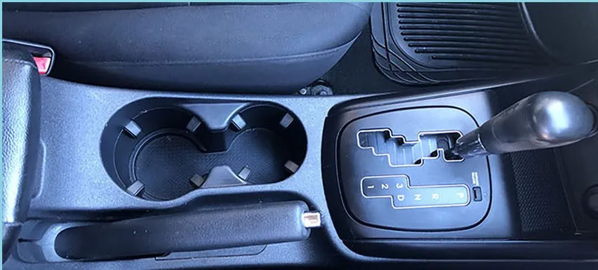 The same console cleaned, trim and cup holders looking new
