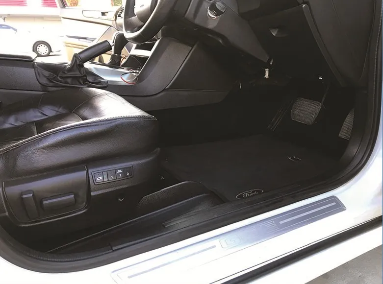 The same footwell after detailing, carpet clean and sill spotless