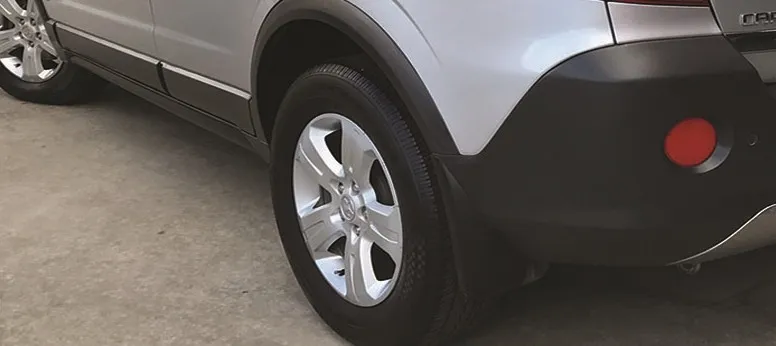 Silver SUV with restored black wheel arches and cladding